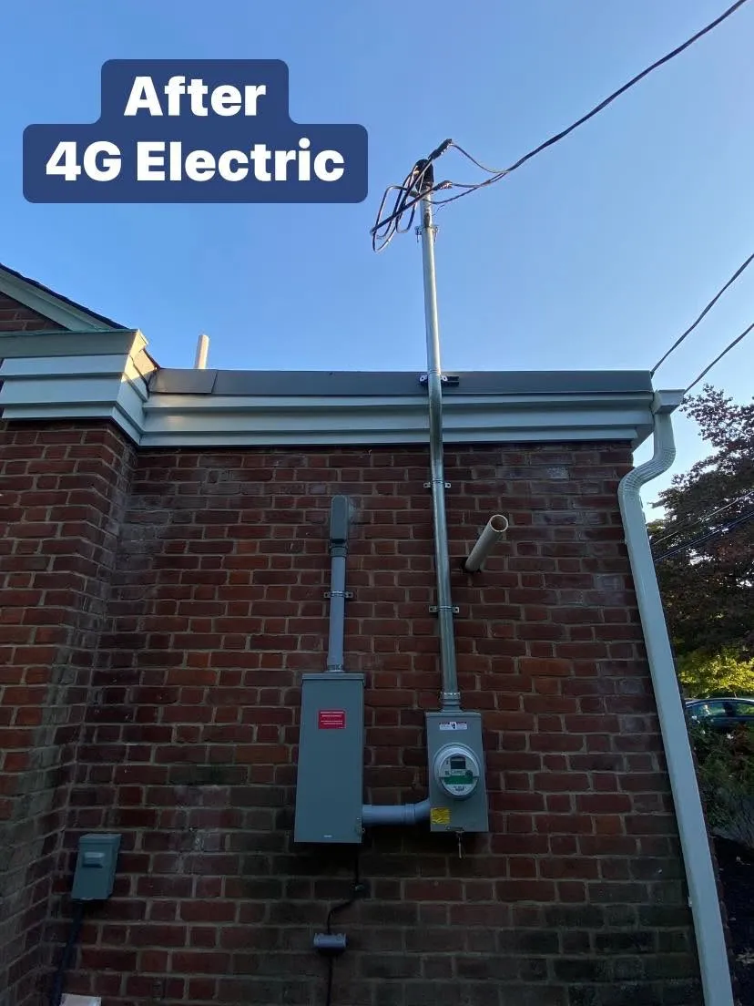 New electrical meter and service mast installed on a brick home by 4G Electric